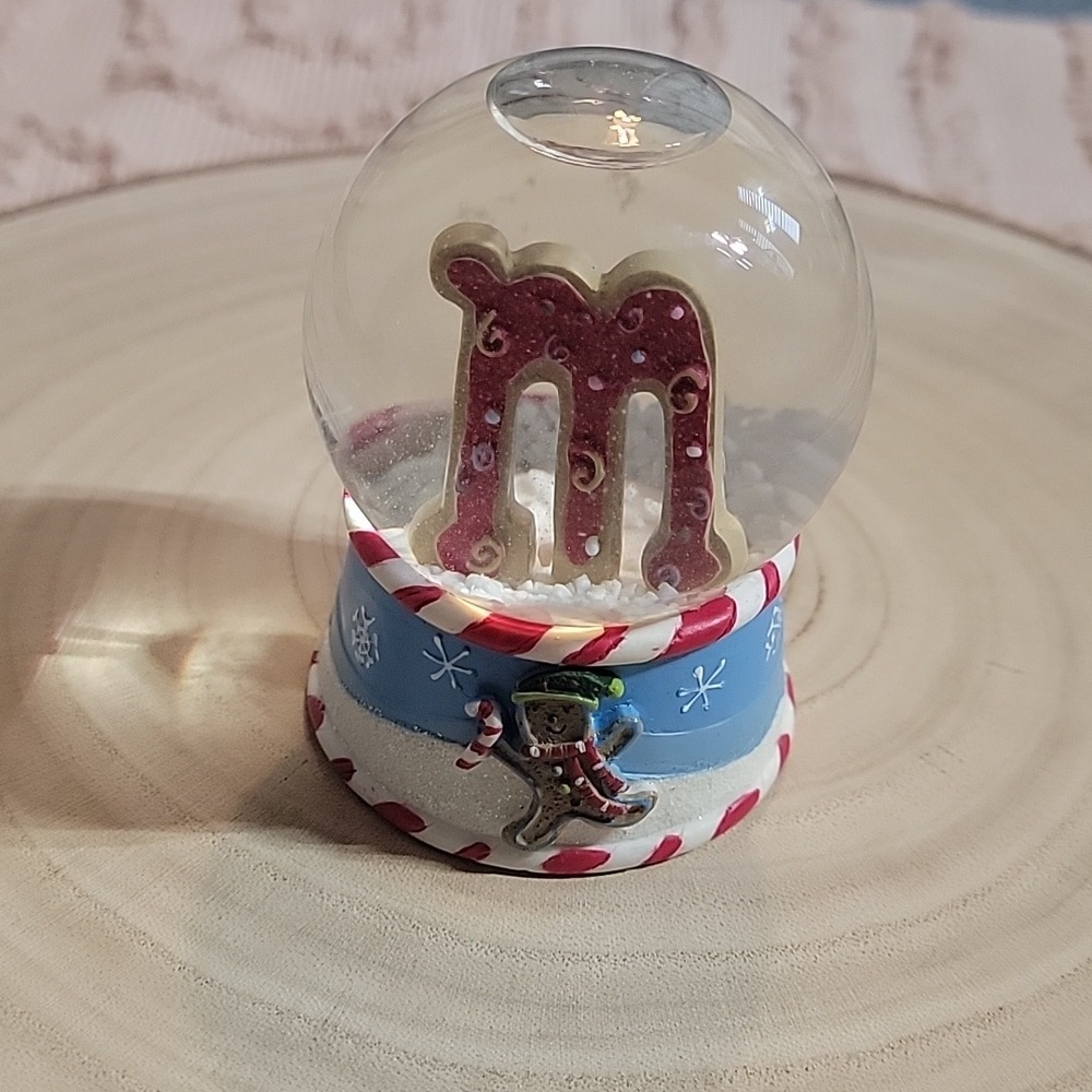 St Nicholas Square "M" Snow Globe featuring little gingerbread man.